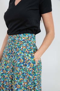 Inserted pocket detail a-line midi silk bamboo green multicoloured printed skirt.