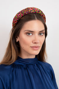 Bold and vibrant silk printed padded headband that is sustainably made in the UK and will give you an elevated look due to the style and fit