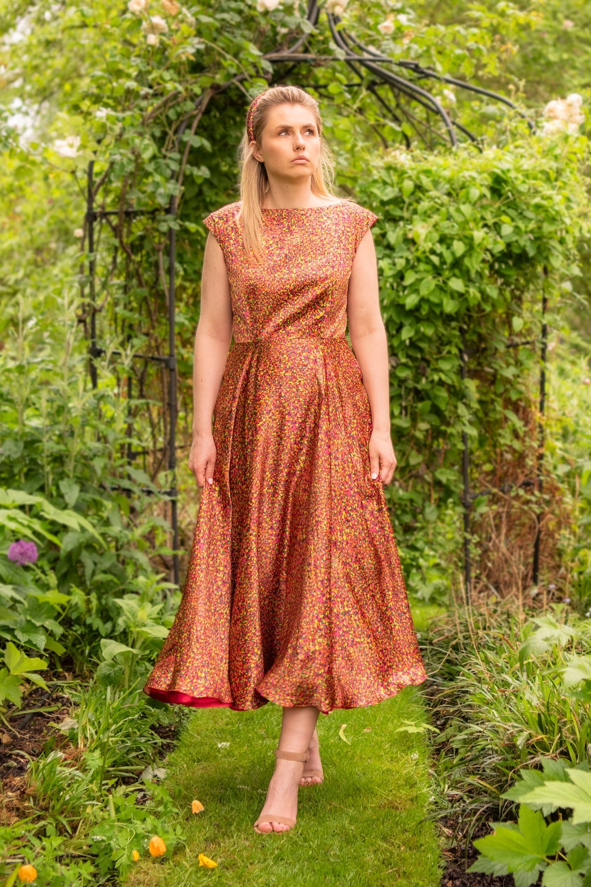 Reversible Victoria Gown Neon Light front view showing it in motion.