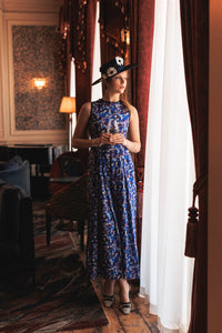 An Isabel Manns sleeveless wide leg silk bamboo jumpsuit and matching belt that comes in a vibrant green print.