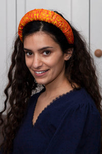 Pixelated Afterglow Padded Headband on a model