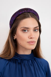 A beautiful silk satin headband in our Purple Mystery print gives you a versatile and stylish hair accessory worn by a stunning model
