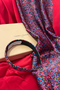 a purple printed silk satin gift box comprising of a matching headband and scarf