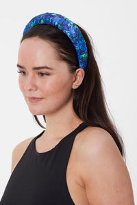 Model wearing aqua flora blue floral silk satin printed headband  made from surplus fabric in UK
