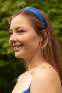 side view of blue floral satin headband hand-made in the UK