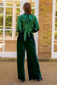 Forest green silk long sleeve halter neck top and velvet palazzo pants back view