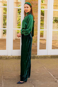 Forest green silk long sleeve halter neck top and velvet palazzo pants side view with matching headband