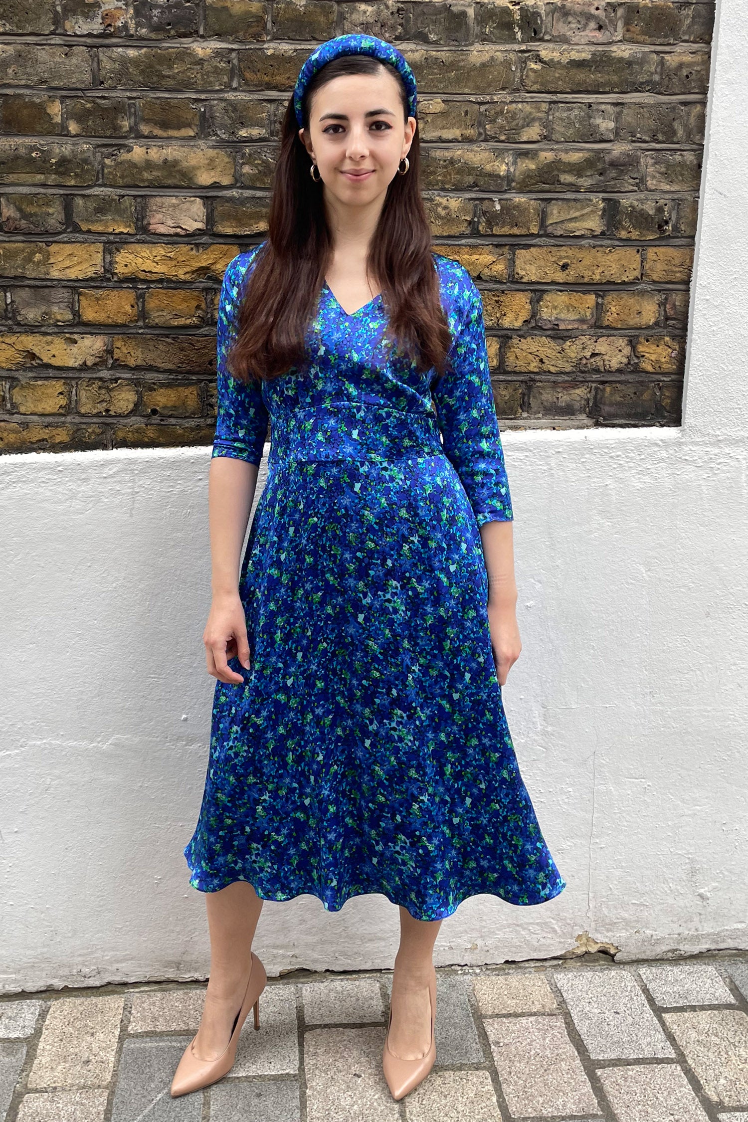 A bespoke Aqua Flora blue printed silk satin dress in our Chloe dress style with bespoke elbow length sleeves