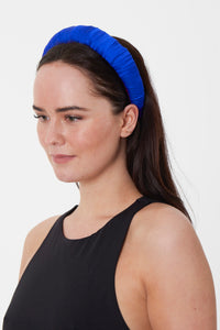 A timeless silk cobalt blue headband ideal for formal events and weddings