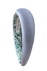 A soft and subtle light blue padded headband that has been hand-made in the UK