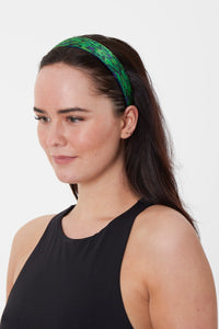 a green printed silk headband
