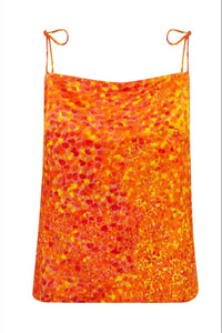 Reversible silk satin slip top with v-back neckline in dotted orange print.