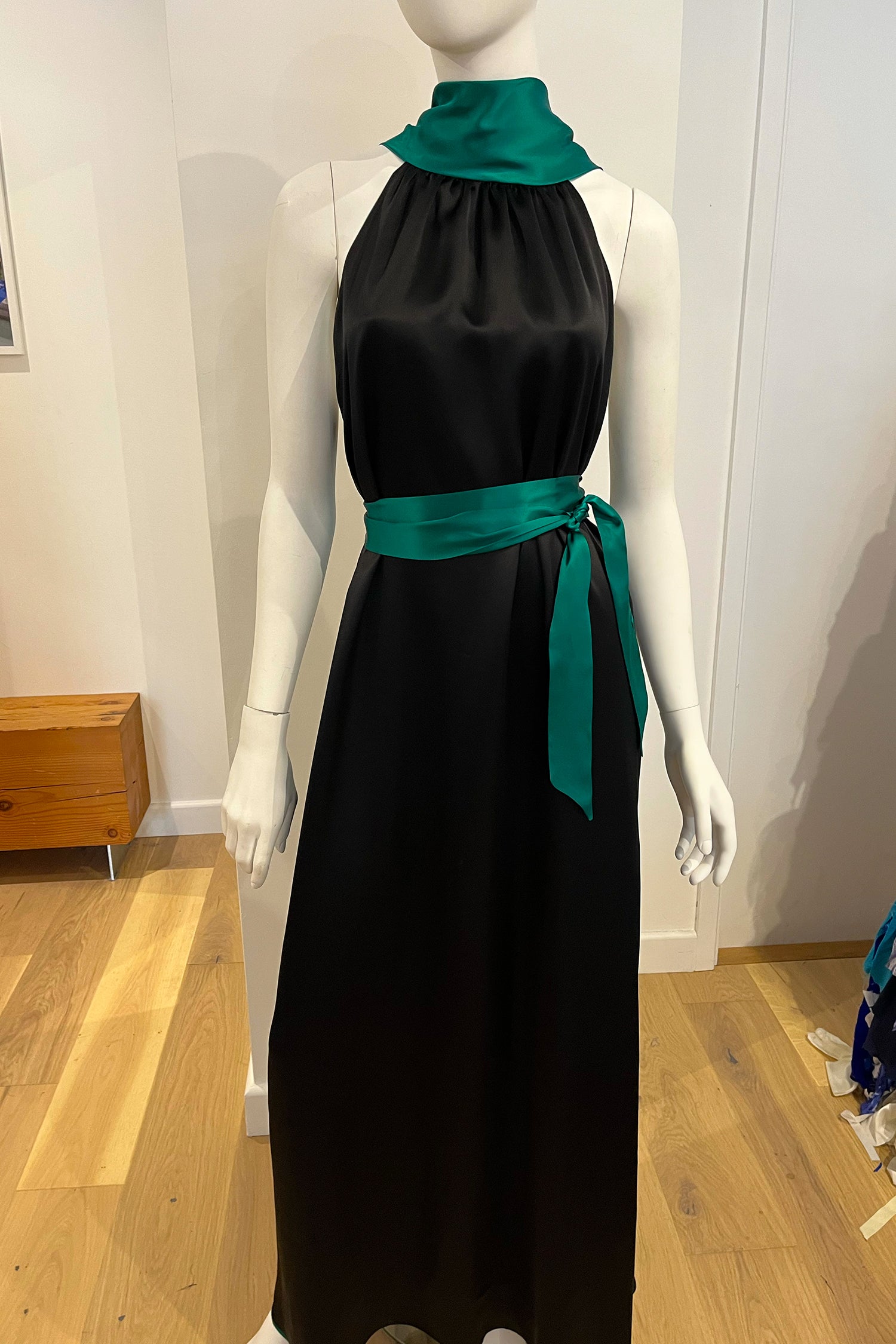 A customised signature Reversible Patricia halter neck dress by Isabel Manns in a customers chosen colour of black and emerald