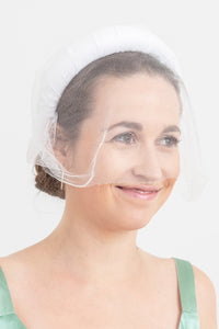 bridal headband in white with white small view on model that is sustainably hand-made in UK