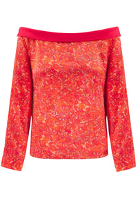 Reversible boat neckline top with ¾ sleeves in vibrant red print.