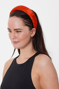 a bold plain orange padded headband sustainably made in the UK