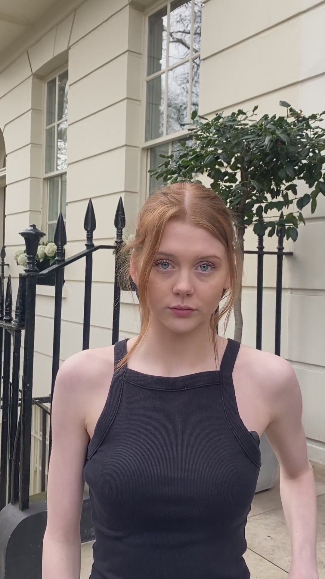 Video of model wearing silk satin teal bow with ribbon styling and silver hair clip.