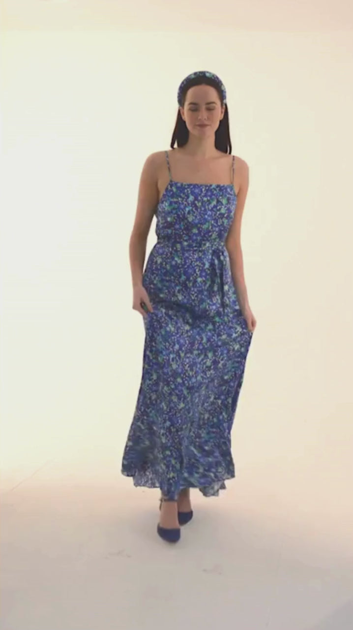 blue floral printed silk satin long slip dress worn elegant by a model with a matching tie belt for fitted looking showing glamour and elegance video
