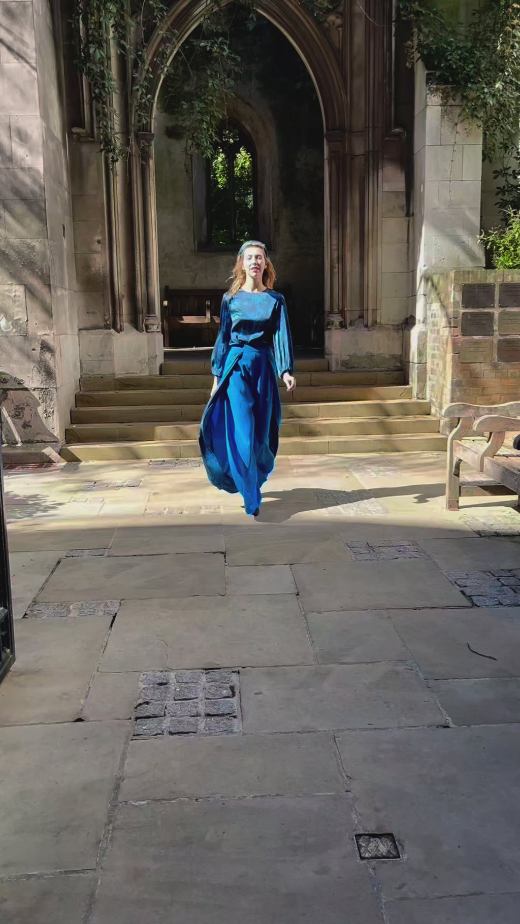 Video of Isabel Manns wide leg wrap around style silk viscose trousers in teal wool crepe and contrasting teal printed silk satin lining, worn with matching silk satin long sleeve top.