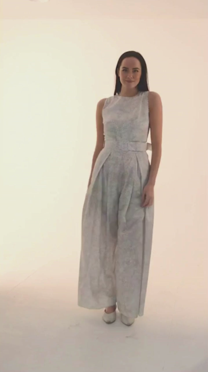 Elegant Isabel Manns Penny jumpsuit crafted from soft focus silk cotton video, showcasing a sleeveless design with elegant lace trim and wide-leg silhouette, made in London.