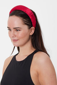 a raspberry dark pink satin padded headband that is timeless and elegant