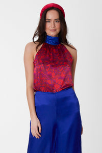 An Isabel Manns reversible halter neck silk satin top with tie collar in vibrant red print.