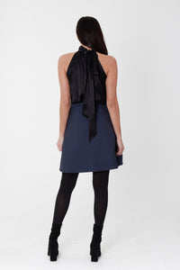 black halter neck top back view with short blue waffle skirt