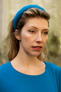 teal wool crepe padded headband elegantly on a models head