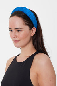 Handmade in the UK this sustainable turquoise padded headband is great for occasions